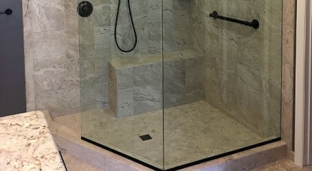 Our team installs fixed panel showers with a gap that serves as an entry into the shower enclosure, like the one pictured here.